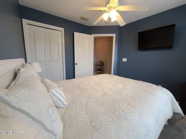bedroom featuring visible vents, a closet, and a ceiling fan