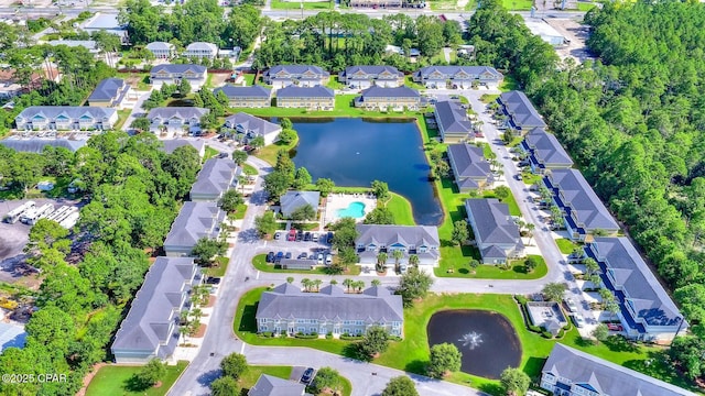 drone / aerial view featuring a residential view and a water view