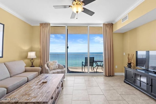 living area featuring ceiling fan, visible vents, baseboards, ornamental molding, and floor to ceiling windows