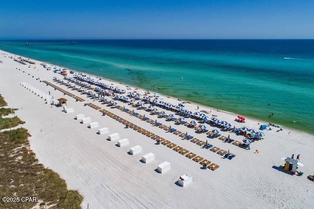 bird's eye view with a beach view and a water view