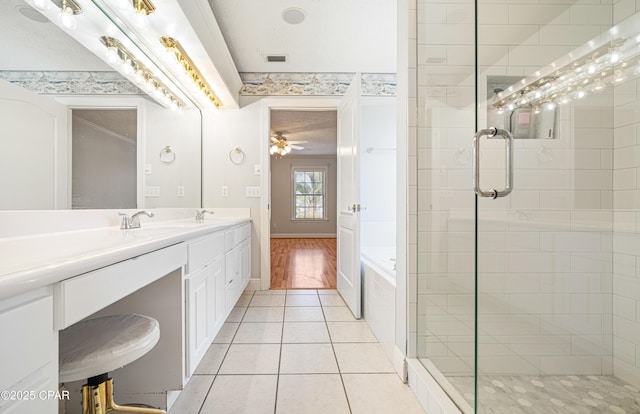 bathroom with double vanity, visible vents, tile patterned floors, a tile shower, and a bath