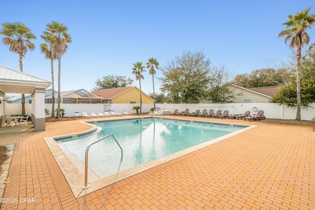 pool featuring a patio area and a fenced backyard