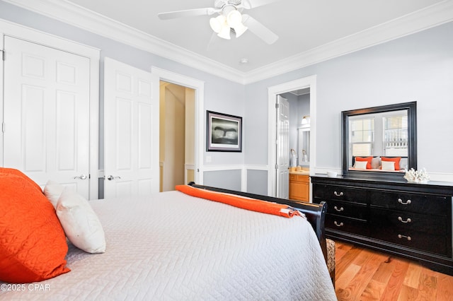 bedroom featuring ceiling fan, light wood-style floors, connected bathroom, and crown molding