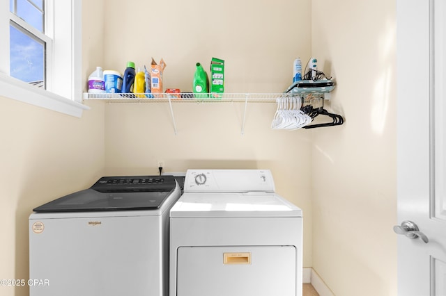 clothes washing area with laundry area and washer and clothes dryer