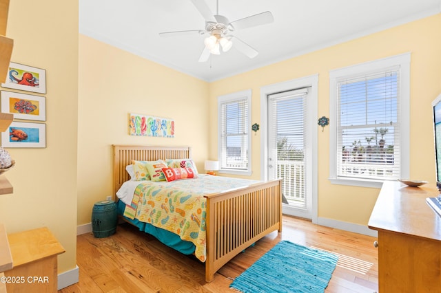 bedroom with access to exterior, ceiling fan, baseboards, and light wood finished floors