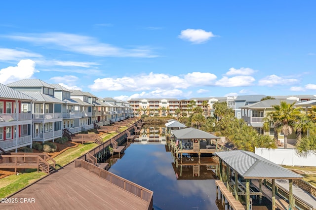 drone / aerial view with a residential view and a water view