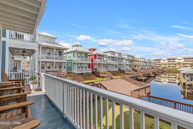 balcony featuring a water view and a residential view