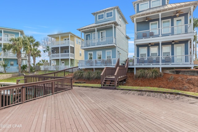 wooden deck featuring a ceiling fan