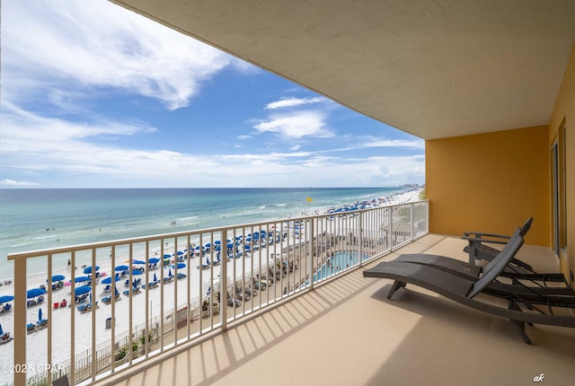 balcony with a view of the beach and a water view