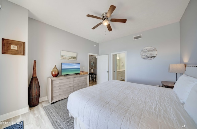 bedroom with visible vents, connected bathroom, baseboards, light wood-style floors, and a ceiling fan