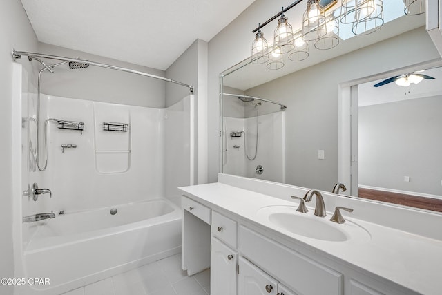 full bath with shower / bath combination, tile patterned flooring, vanity, and a ceiling fan