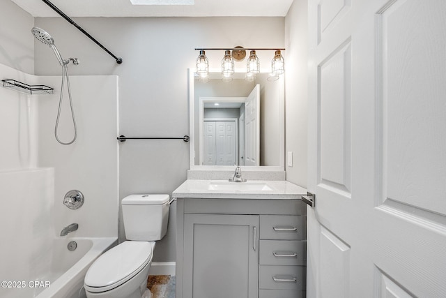 bathroom with toilet,  shower combination, and vanity