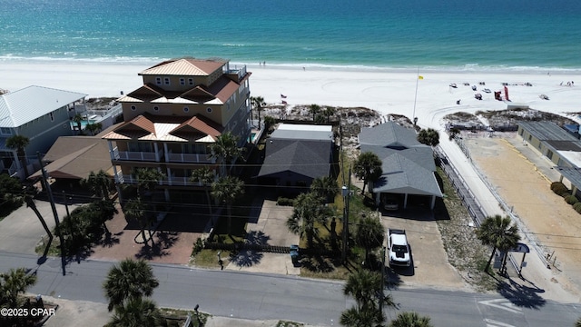 bird's eye view with a water view and a beach view