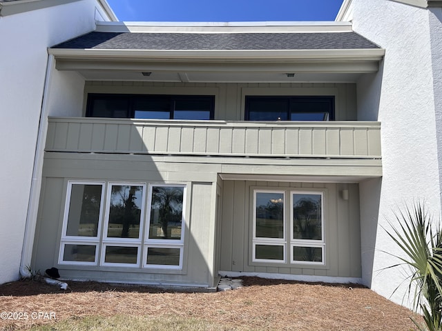 4305 Bay Point Rd Unit 459, Panama City, FL 32408 - rear view of house featuring roof with shingles and a balcony