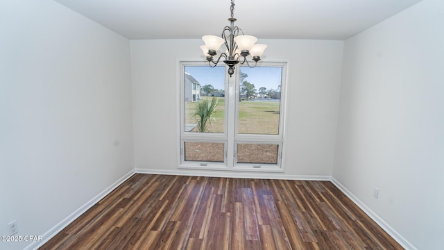 4305 Bay Point Rd Unit 459, Panama City, FL 32408 - unfurnished dining area featuring baseboards, a chandelier, and dark wood-style floors