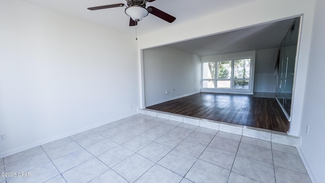 4305 Bay Point Rd Unit 459, Panama City, FL 32408 - tiled empty room with baseboards and a ceiling fan