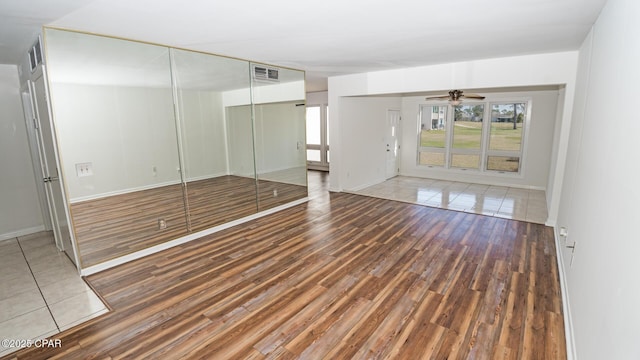 4305 Bay Point Rd Unit 459, Panama City, FL 32408 - unfurnished room featuring baseboards, a ceiling fan, visible vents, and wood finished floors