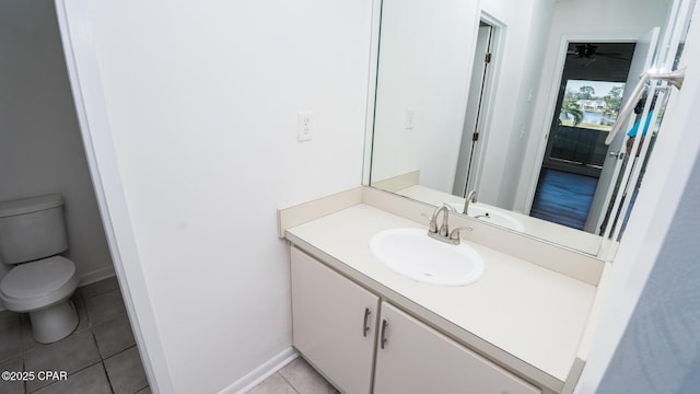 4305 Bay Point Rd Unit 459, Panama City, FL 32408 - bathroom with toilet, baseboards, tile patterned floors, and vanity