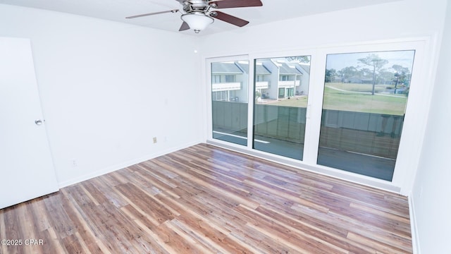 4305 Bay Point Rd Unit 459, Panama City, FL 32408 - unfurnished room featuring wood finished floors, baseboards, and ceiling fan