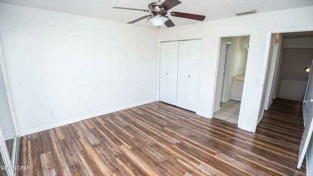 4305 Bay Point Rd Unit 459, Panama City, FL 32408 - unfurnished bedroom with a closet, wood finished floors, visible vents, a ceiling fan, and baseboards