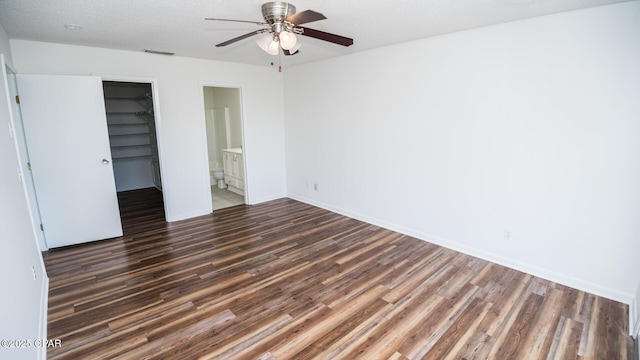 4305 Bay Point Rd Unit 459, Panama City, FL 32408 - unfurnished bedroom with a closet, dark wood finished floors, visible vents, and a spacious closet