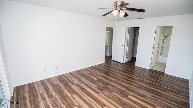 4305 Bay Point Rd Unit 459, Panama City, FL 32408 - unfurnished bedroom with connected bathroom, wood finished floors, a closet, visible vents, and baseboards