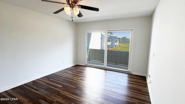 4305 Bay Point Rd Unit 459, Panama City, FL 32408 - unfurnished room featuring dark wood finished floors, baseboards, ceiling fan, and a textured ceiling