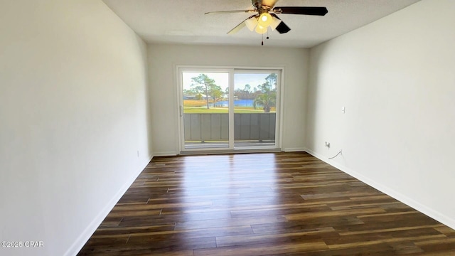 4305 Bay Point Rd Unit 459, Panama City, FL 32408 - spare room with dark wood-style floors, baseboards, and a ceiling fan
