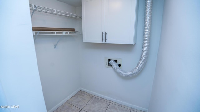 4305 Bay Point Rd Unit 459, Panama City, FL 32408 - clothes washing area featuring cabinet space, baseboards, and light tile patterned flooring
