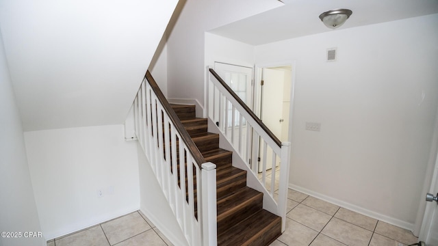 4305 Bay Point Rd Unit 459, Panama City, FL 32408 - staircase featuring baseboards, tile patterned flooring, and visible vents