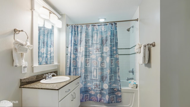 bathroom featuring shower / bath combination with curtain and vanity