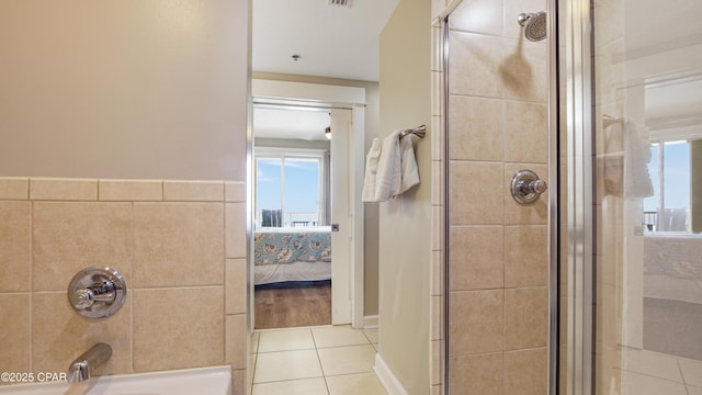 ensuite bathroom with a bath, tile patterned flooring, connected bathroom, and tiled shower