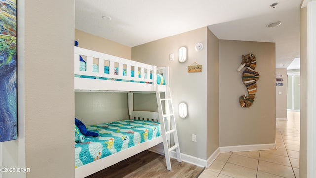 tiled bedroom with baseboards