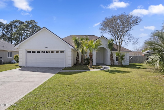 view of front of home featuring an attached garage, fence, driveway, stucco siding, and a front lawn