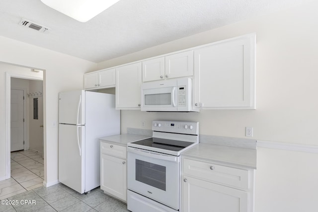 kitchen featuring a textured ceiling, white appliances, visible vents, white cabinetry, and light countertops