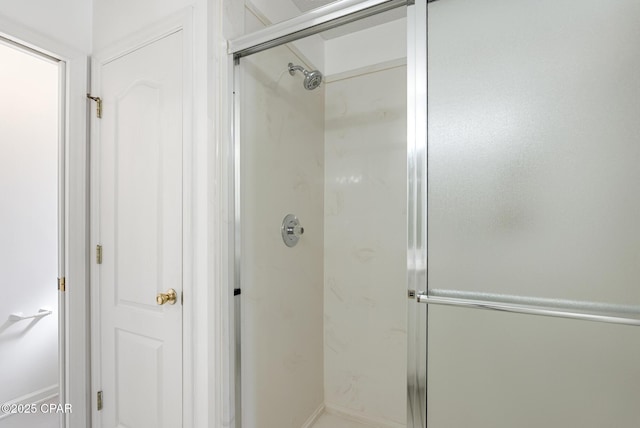 full bath featuring a shower stall