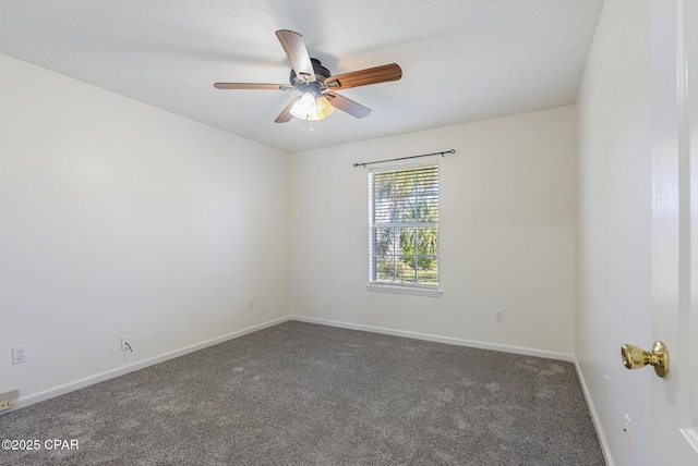 carpeted spare room featuring a ceiling fan, a textured ceiling, and baseboards