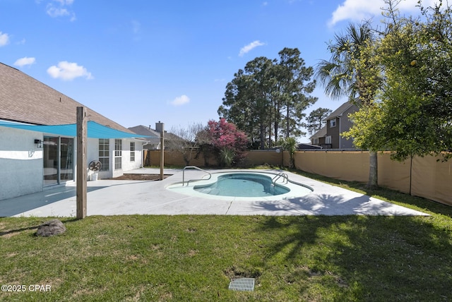 view of swimming pool with a patio area, a fenced backyard, and a yard