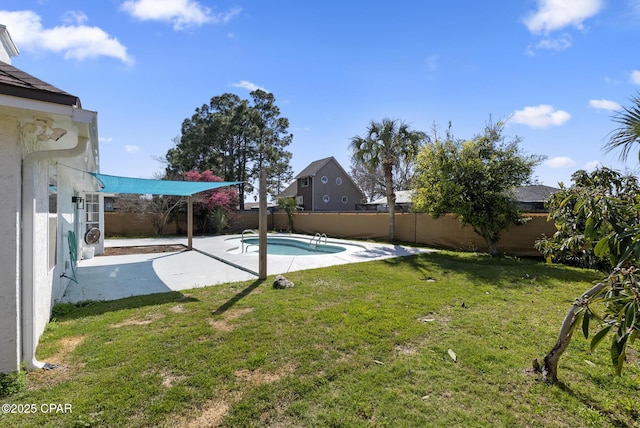 view of yard featuring a fenced in pool, a fenced backyard, and a patio