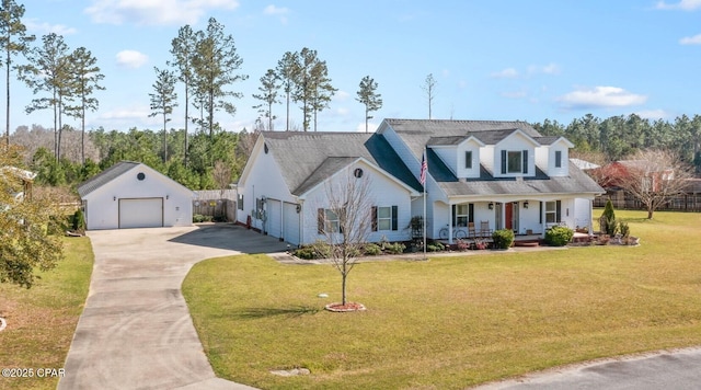 view of front of house with an outbuilding, a front lawn, fence, covered porch, and a garage