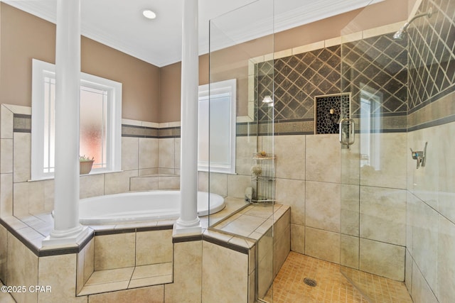 bathroom with a bath, a shower stall, and decorative columns