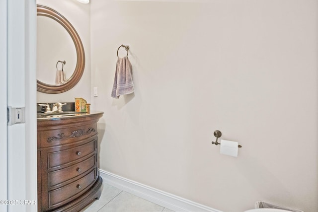 bathroom featuring tile patterned floors, baseboards, and vanity