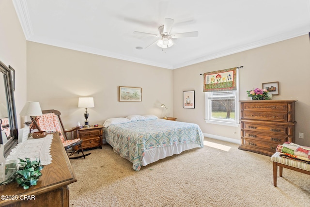 bedroom with carpet flooring, baseboards, ceiling fan, and ornamental molding