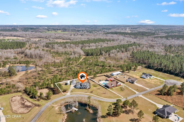 aerial view featuring a wooded view