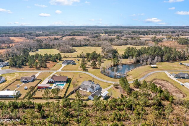 drone / aerial view with a water view and a rural view