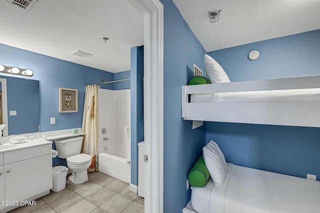 interior space featuring shower / bath combination with curtain, visible vents, toilet, vanity, and tile patterned floors