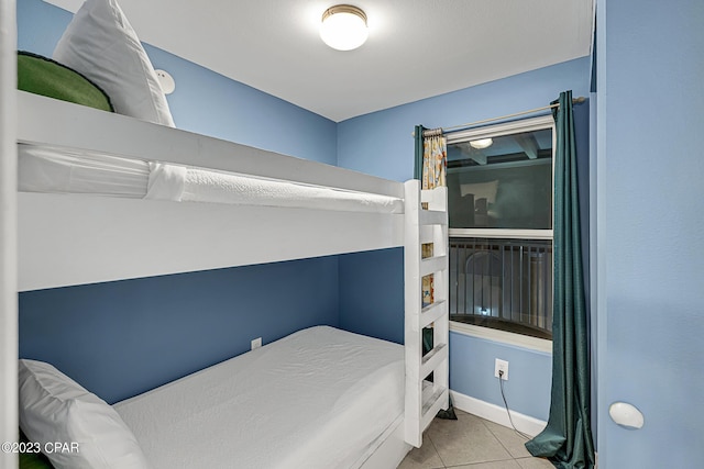 tiled bedroom with baseboards