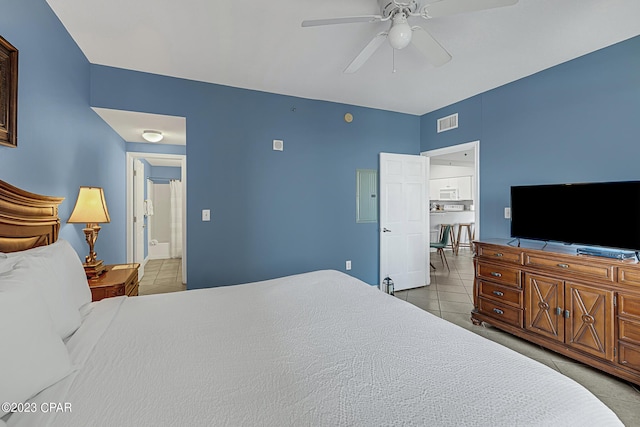 bedroom with ceiling fan, visible vents, and tile patterned floors