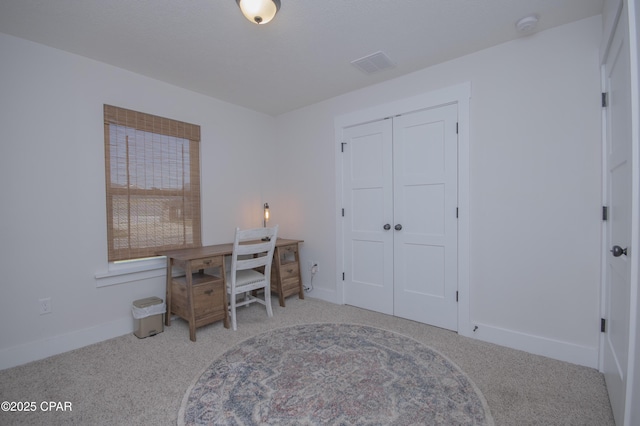 home office with baseboards, visible vents, and carpet floors