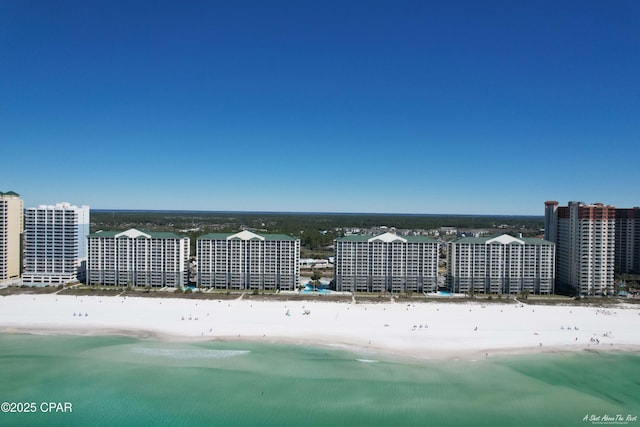 bird's eye view with a city view, a beach view, and a water view